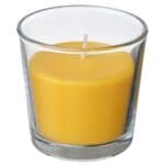 SVARTOXBÄR Scented candle in glass, Mimosa/yellow, 25 hr