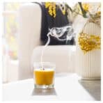 SVARTOXBÄR Scented candle in glass, Mimosa/yellow, 25 hr - Image 4