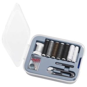 Compact sewing kit with threads, needles, and tools for quick repairs.