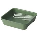 Green plastic dish rack for kitchen and dish drying.