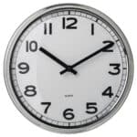 Silvery round wall clock showing time, stylish home decor clock for living room or office.