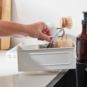 Reusable kitchen utensil storage container for dishwashing and organization.