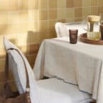 Cozy dining table with beige chairs, brown glass, and water pitcher for home and kitchen essentials.
