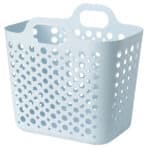 Plastic laundry basket with holes for ventilation.