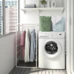 Washer and laundry area with organized clothes and laundry baskets for efficient online shopping | OKDEALS.