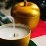 INTERFINT Scented candle in metal tin, apple-shaped/Apple and cinnamon gold-colour, 24 hr - Image 3