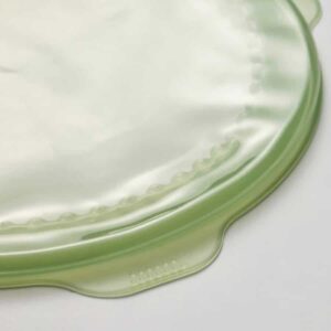 Green glass dinner plate with a stylish design, perfect for online shopping and home dining.