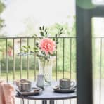 Flower vase with pink flower and greenery, perfect for home decor and online shopping at OKDEALS.