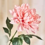 Elegant pink artificial flower for home decor or gifts.