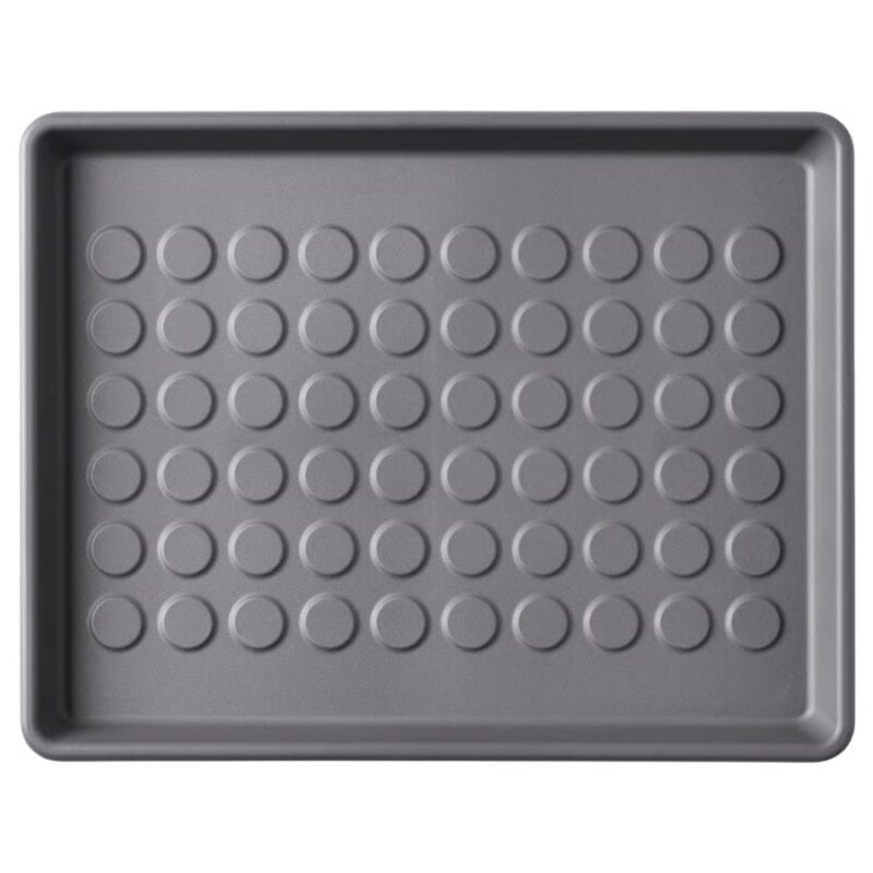 Non-stick baking tray with uniform circular indentations, ideal for baking and cooking needs.