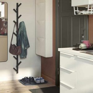 Versatile wall-mounted coat rack with hooks, shoe tray, and storage for home organization.