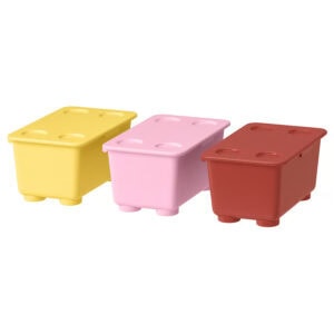 Set of three colorful GLIS storage boxes with lids in yellow pink and red.