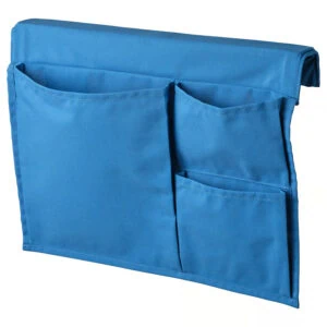 Blue STICKAT bed pocket with multiple compartments for storage.