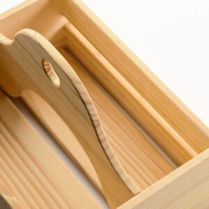 Wooden portable organizer with compartments for storage.