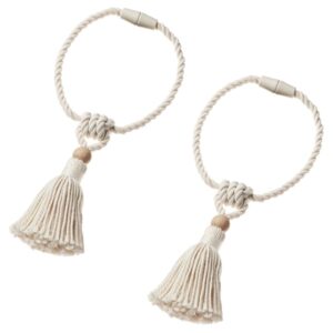 Off-white tassel magnetic curtain tie-back for elegant window decor.
