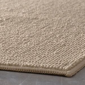 FINTSEN beige bath mat with textured surface, 40x60 cm size.