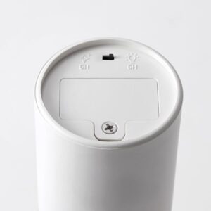 Battery-operated white LED table decoration with control switch.