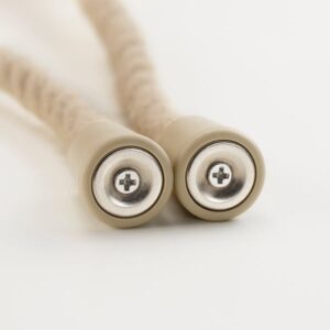 Magnetic curtain tie-back with beige/beech design for stylish home decor.